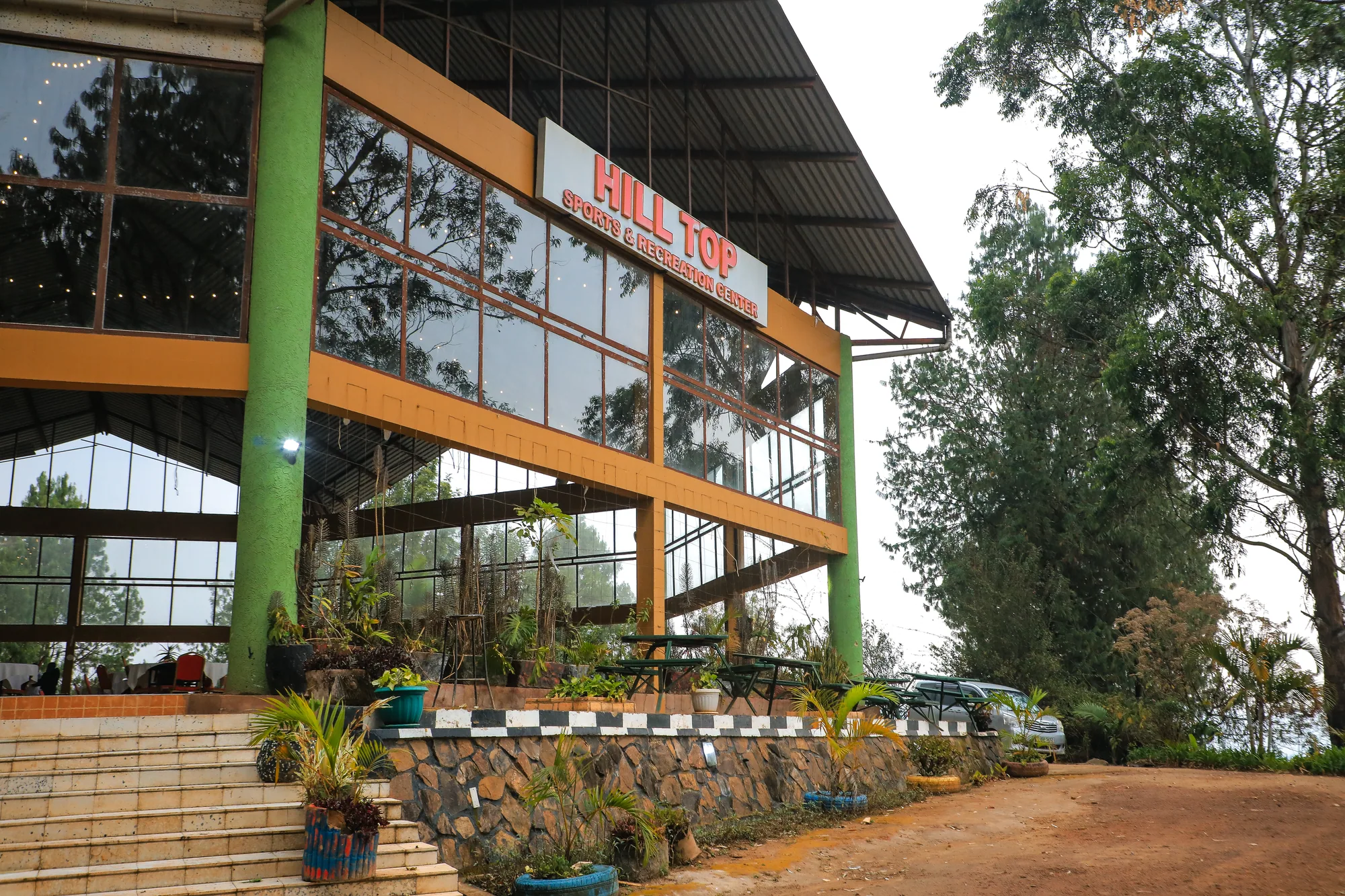 The Hill Top Events and Exhibition Centre building with its signage and glazed front from the drive