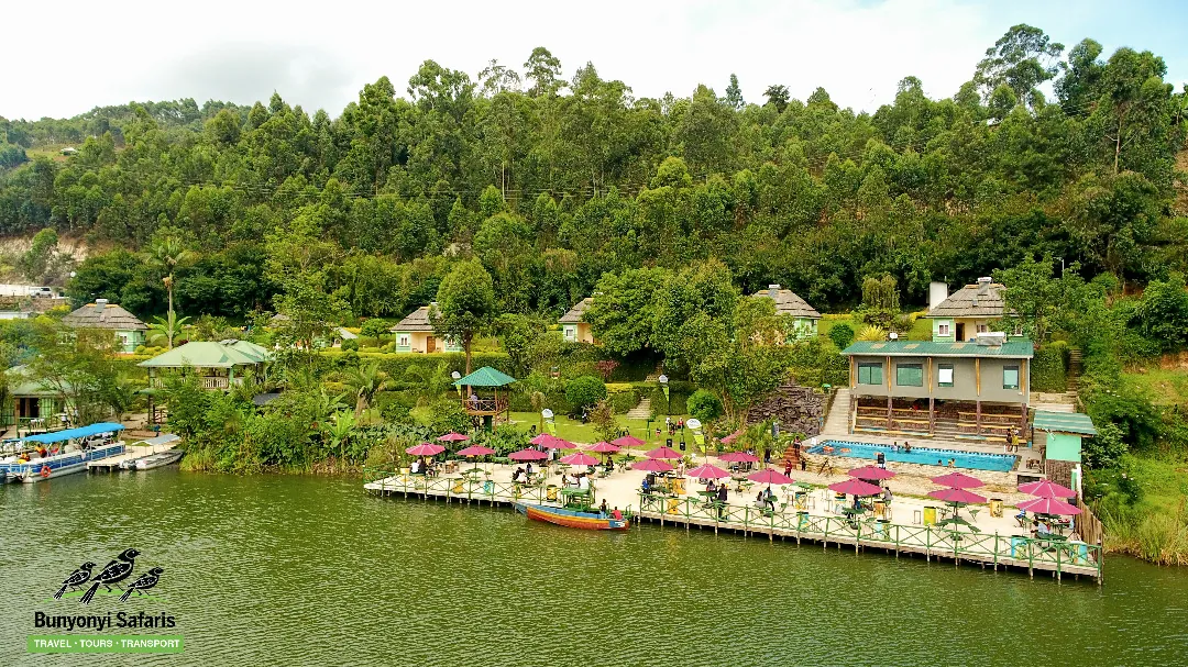 Aerial view of the waterfront gardens, thatched gazebos and pink parasols on the peninsula