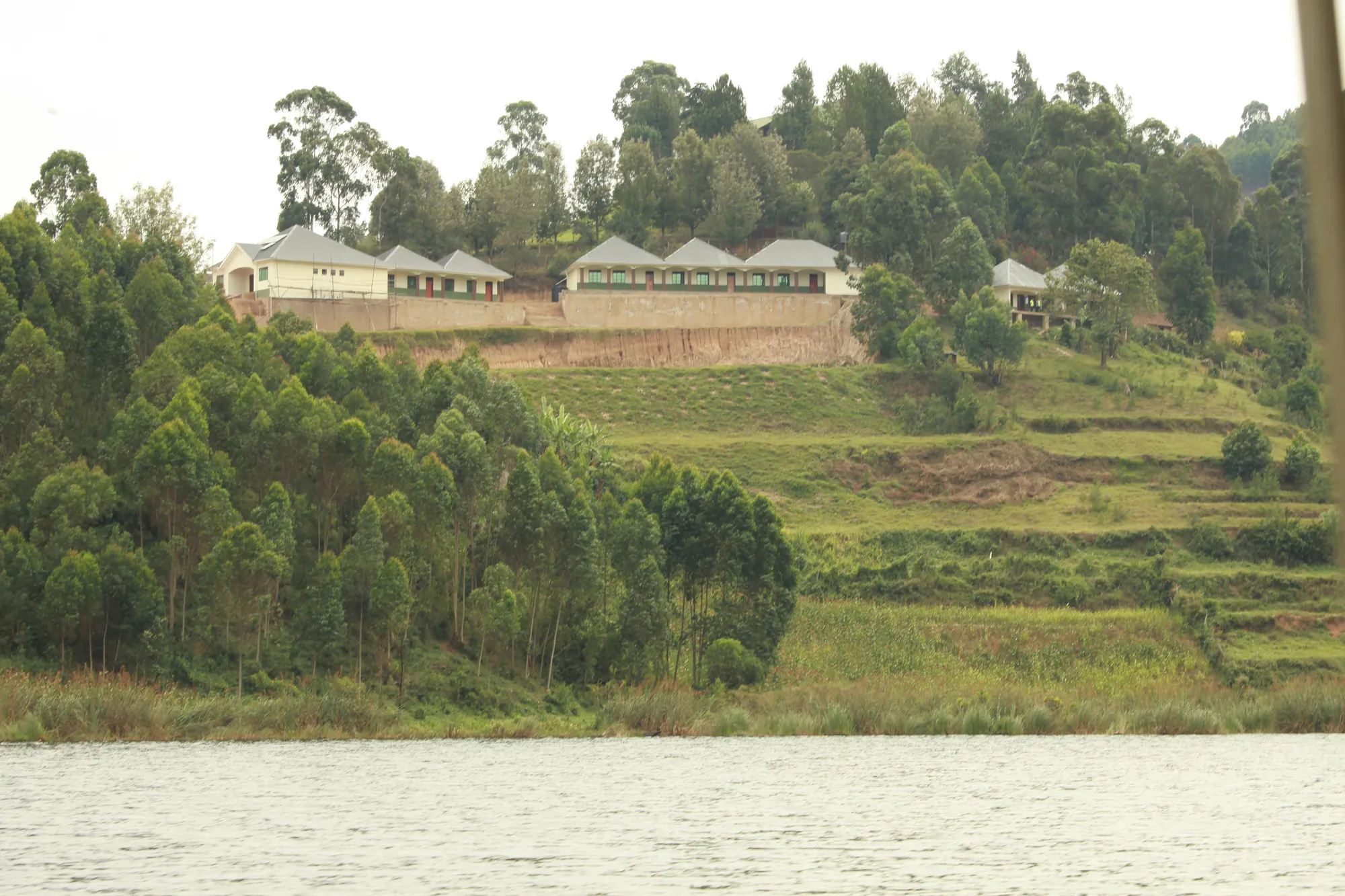 The institute buildings on the ridge above the lake, seen across the water