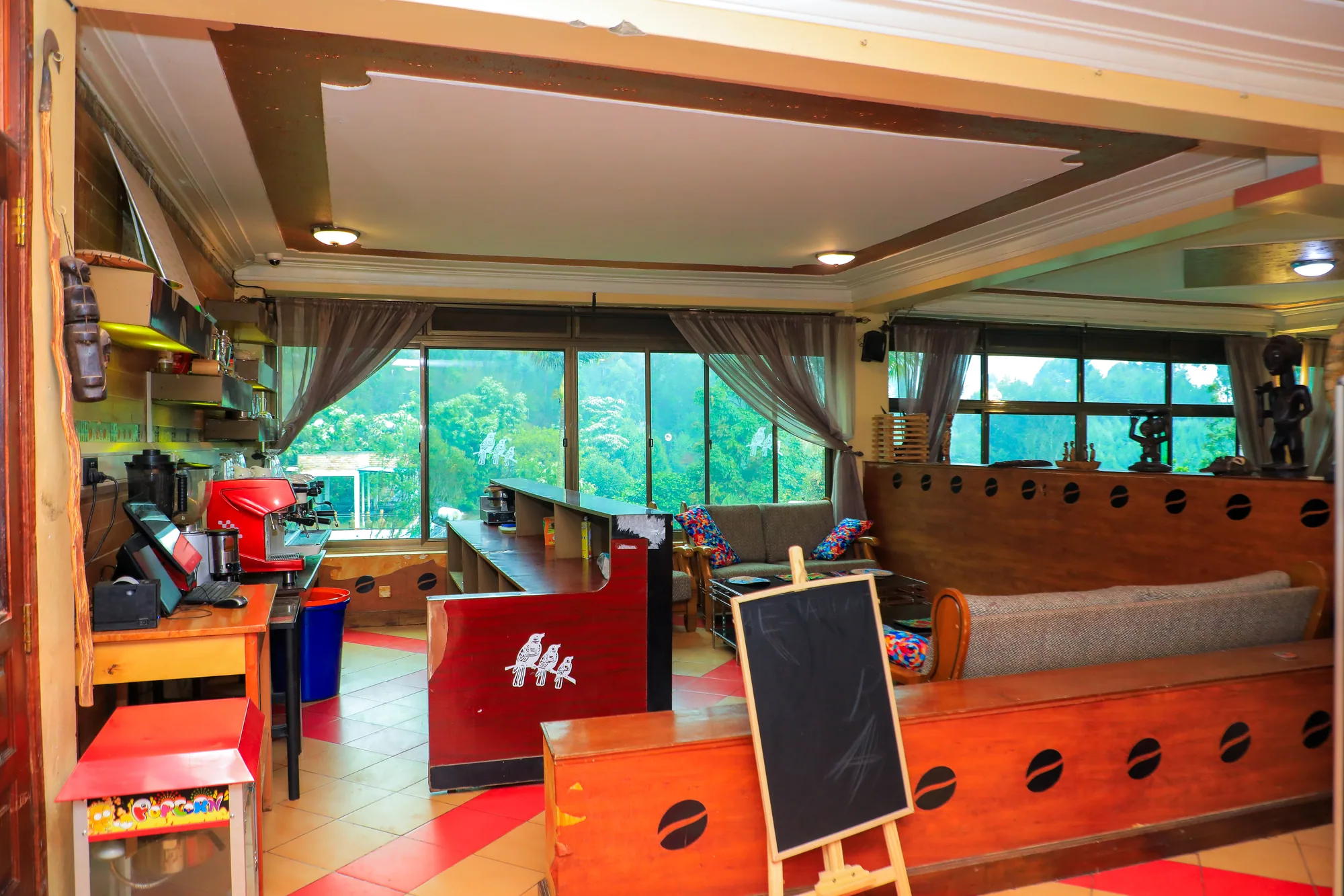 The indoor games area with a foosball table, chalkboard and children's toys