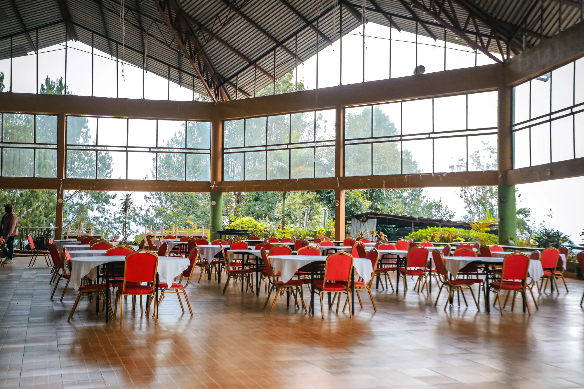 The events hall from the entrance, glazed on all sides with tables ready