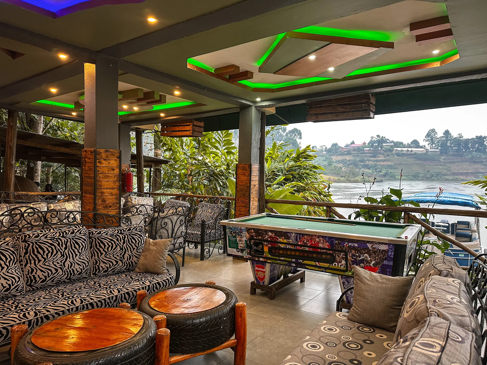 The lakeside games lounge with zebra-print sofas, tyre-based tables and a pool table