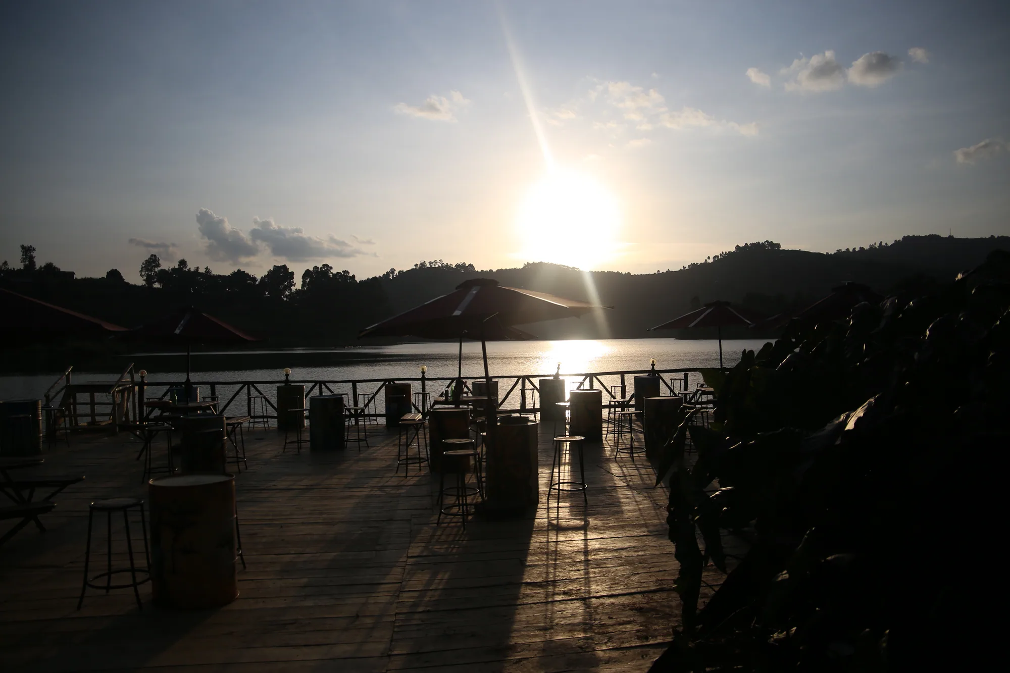 Sunset over Lake Bunyonyi seen from the resort's wooden lakeside deck