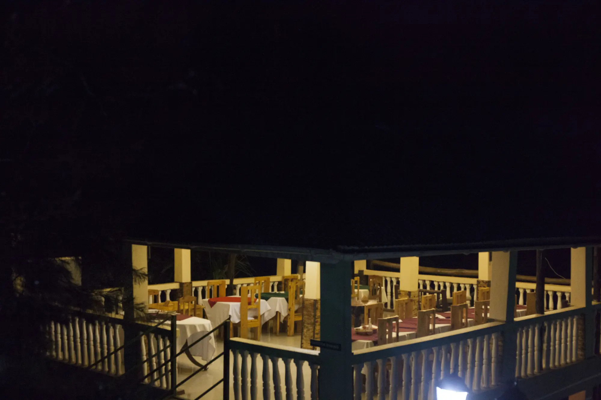 Terrace restaurant seating lit in the evening