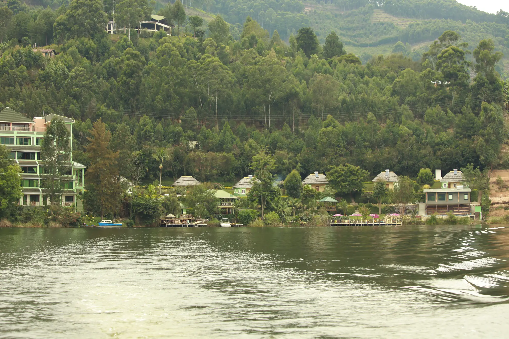 The shoreline gazebos and hotel block viewed across the lake from further out