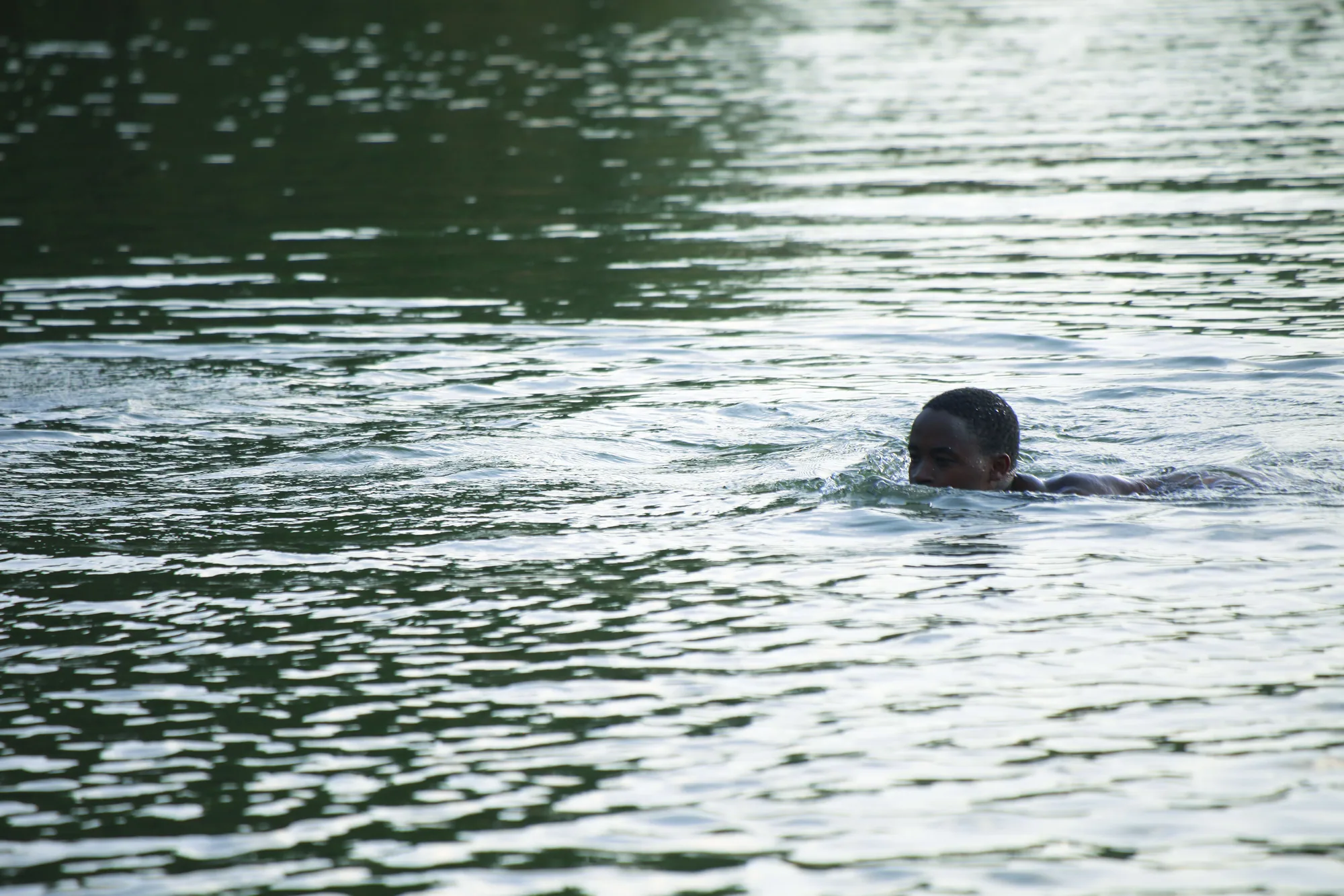 A swimmer in the open water of the lake