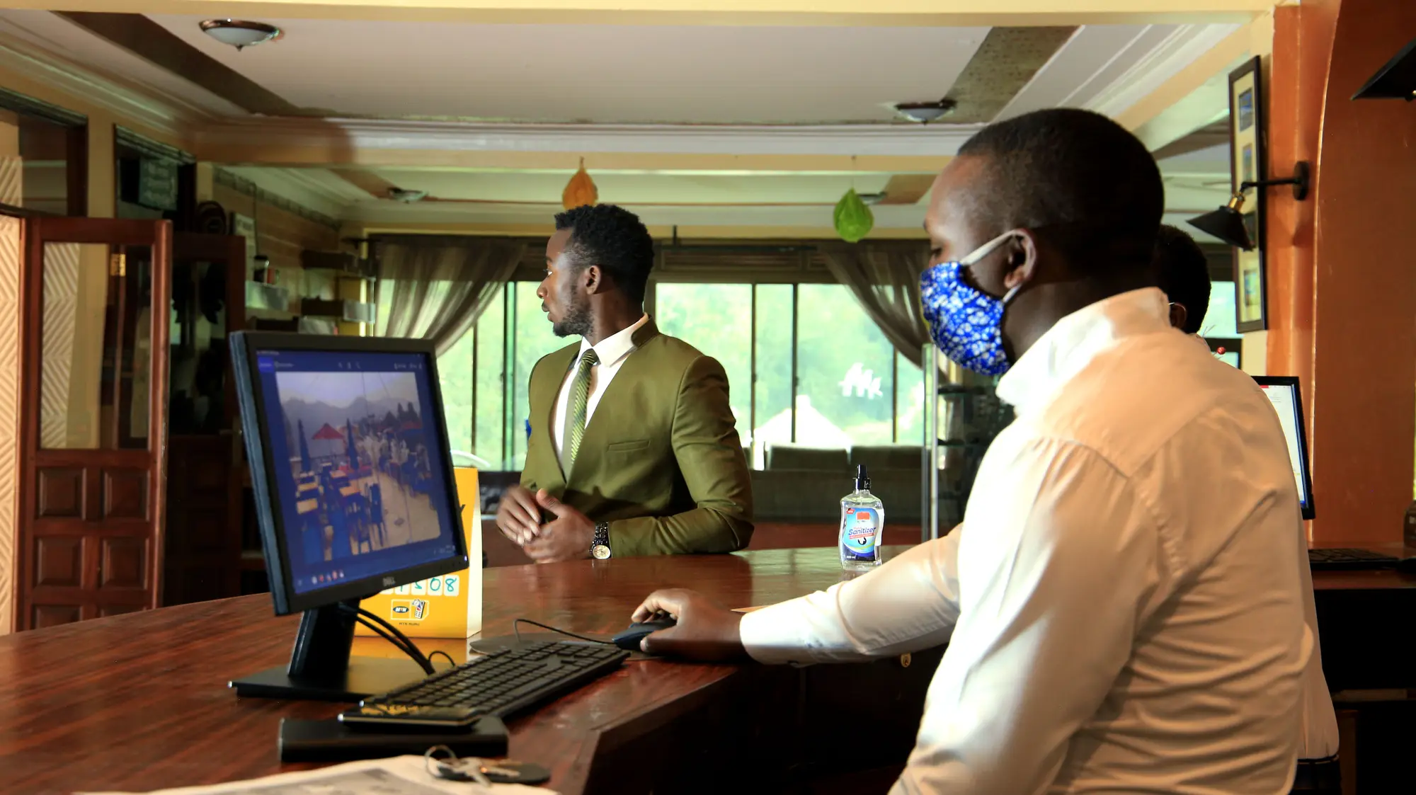 Guest checking in at the front desk with a member of staff