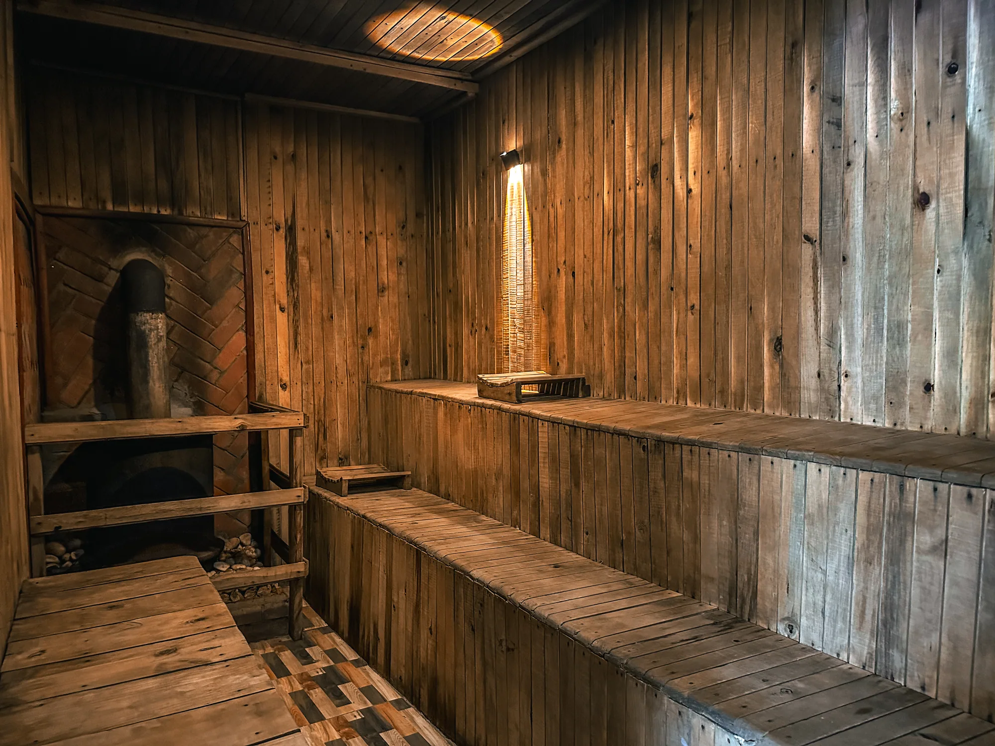 The sauna bench and heater alcove seen from the corner